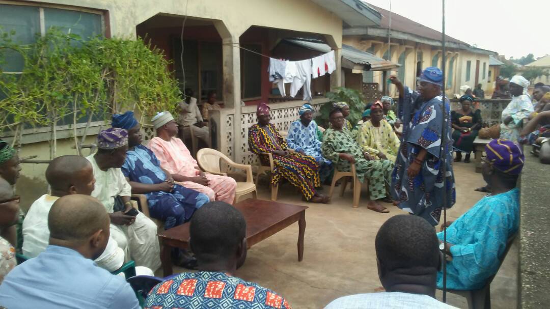 The All Progressive Congress (APC) Ekiti State governorship aspirant, Dr. Wole Oluyede (in blue attire), sitting in the centre, during a visit of the aspirant and his team to Ikole Ekiti, home of his maternal grandparents. Standing is one of the elders making a welcome speech on Tuesday. Photo: Adewumi Ademiju 