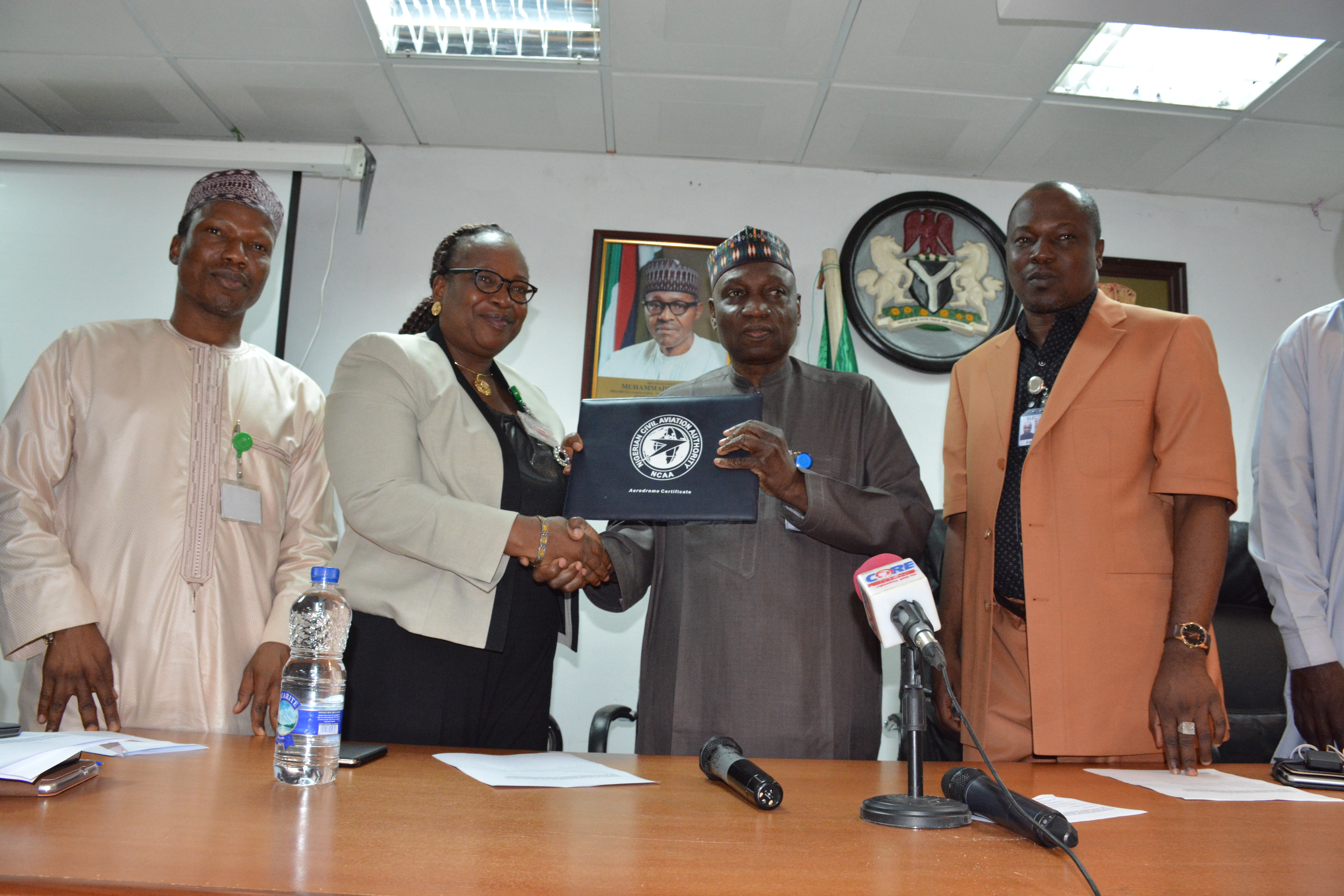 L-R: The Director, Airport Operations, Capt. Hamisu Yadudu Airport Operations; Airport Manager, MMA, Lagos, Mrs. Victoria Shin-Aba; Managing Director, Federal Airports Authority of Nigeria (FAAN), Engr.  Saleh Dunomi and a member of the MMA certification Team  during the presentation of the certificate to the airport manager, Mrs. Shin- Aba at the FAAN headquarters on Monday.