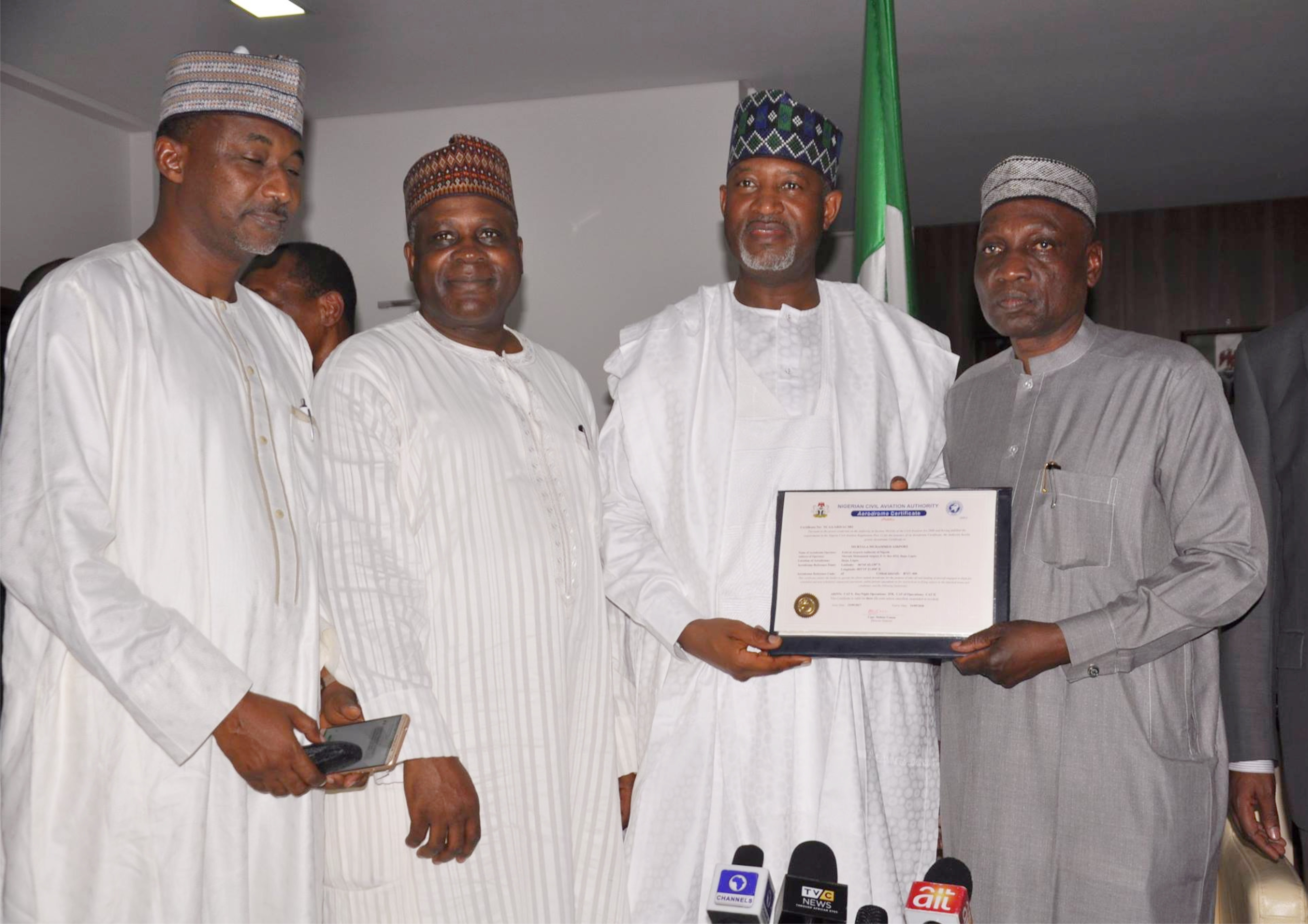 Permanent Secretary, Ministry of Transportation, Alh. Sabiu Zakari; Director General, Nigerian Civil Aviation Authority (NCAA) Capt. Usman Mukhtar;  Hon. Minister of State, Aviation, Sen. Hadi Sikrika and  Managing Director, Federal Airports Authority of Nigerian (FAAN) Engr. Saleh Dunoma during the presentation of the certificate to the honourable minister in Abuja recently.