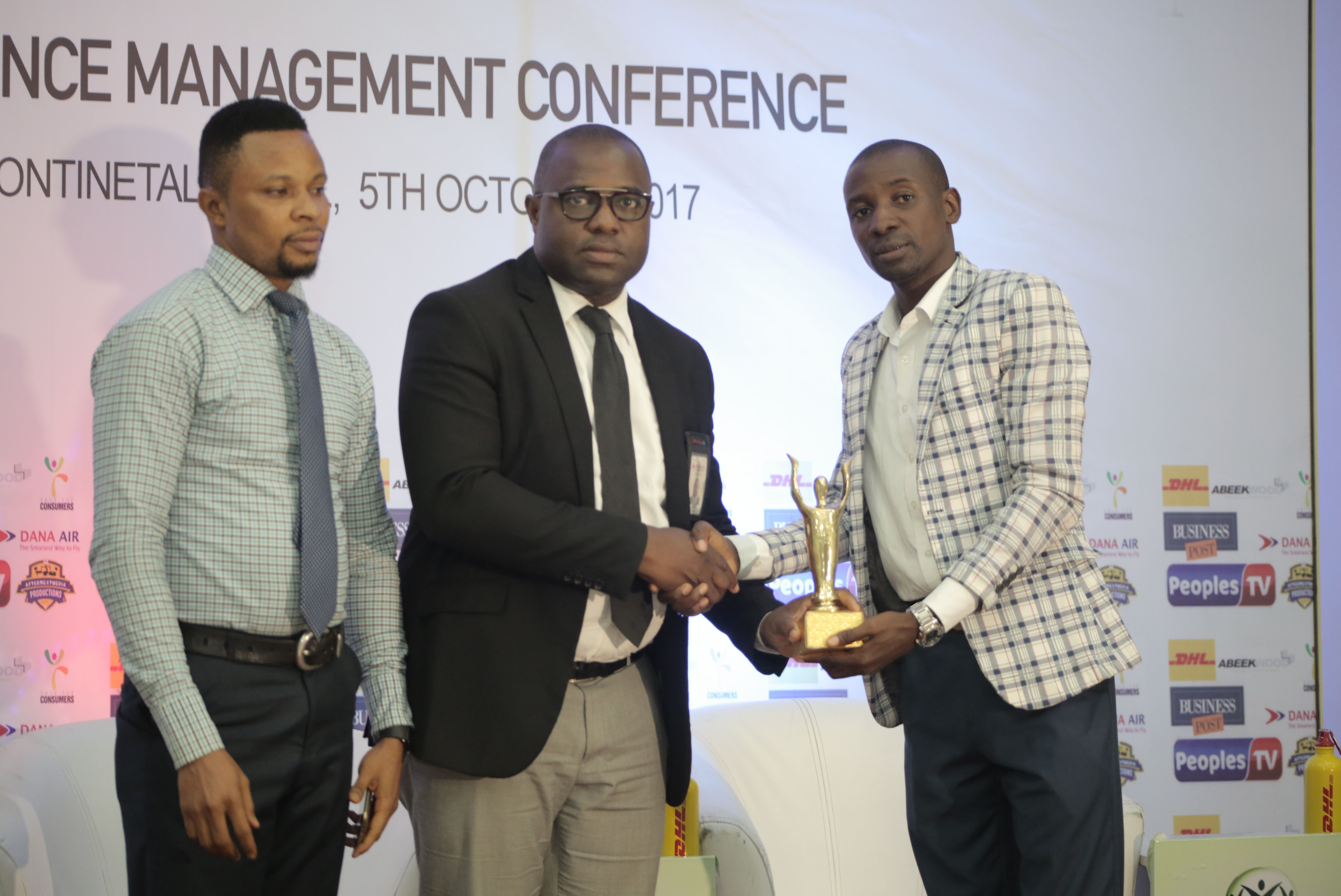 L-R Dana  Air Abuja Sales Executive, Kingsley Inyang, Dana Air Abuja Sales Manager,  Oluremi Jibodu and Managing Director of Nigerian Customer Service Awards Limited Dr Aliyu Ilias during the presentation of the 4th Best Customer Service Airline to Dana Air recently in Abuja.