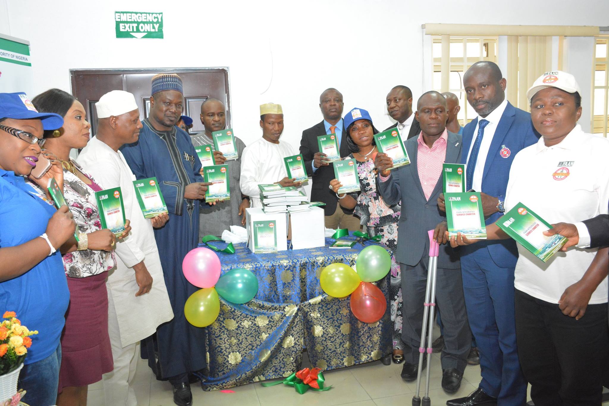 Management staff of Federal Airports Authority of Nigeria (FAAN) and Head of the Presidential Servicom Office, Mrs. Nnenna Akaji Emele in a group photograph displaying the service charter book on Wednesday.