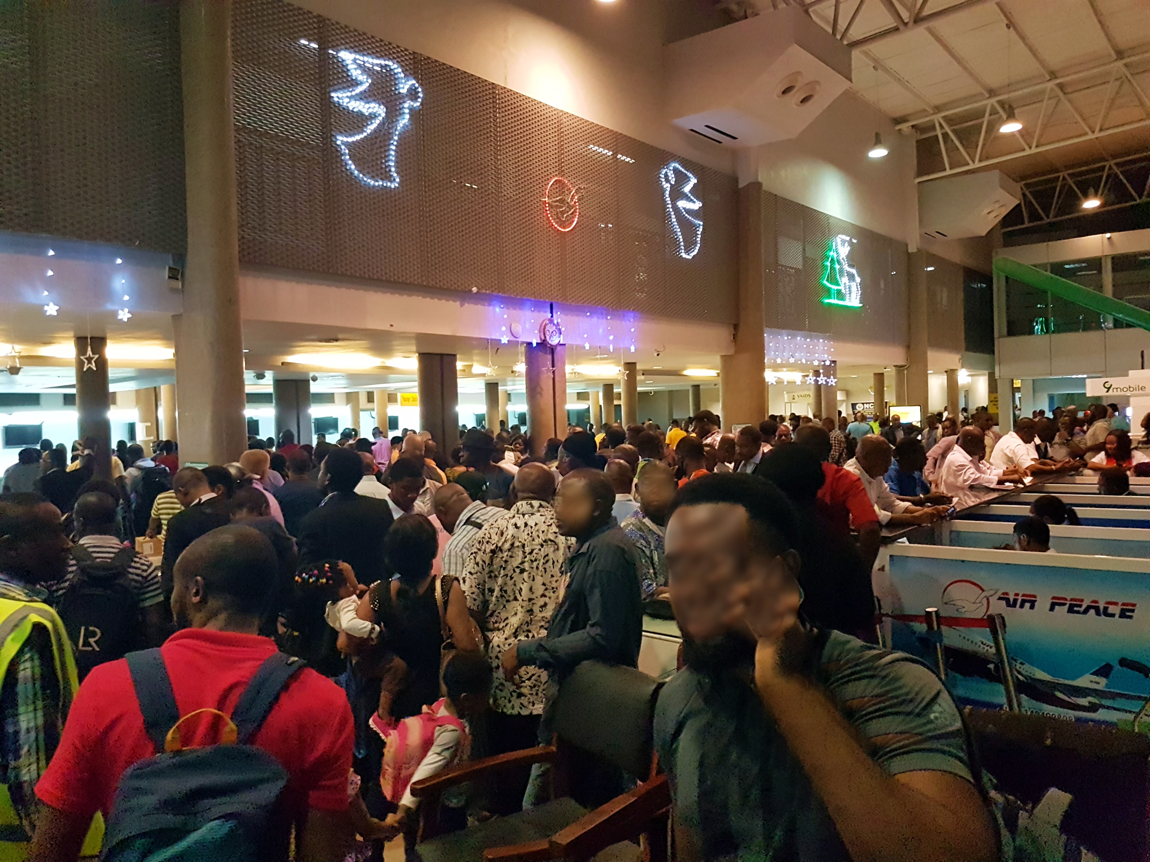 Photograph of huge turnout of air passengers in one of FAAN's airport terminals during yuletide.