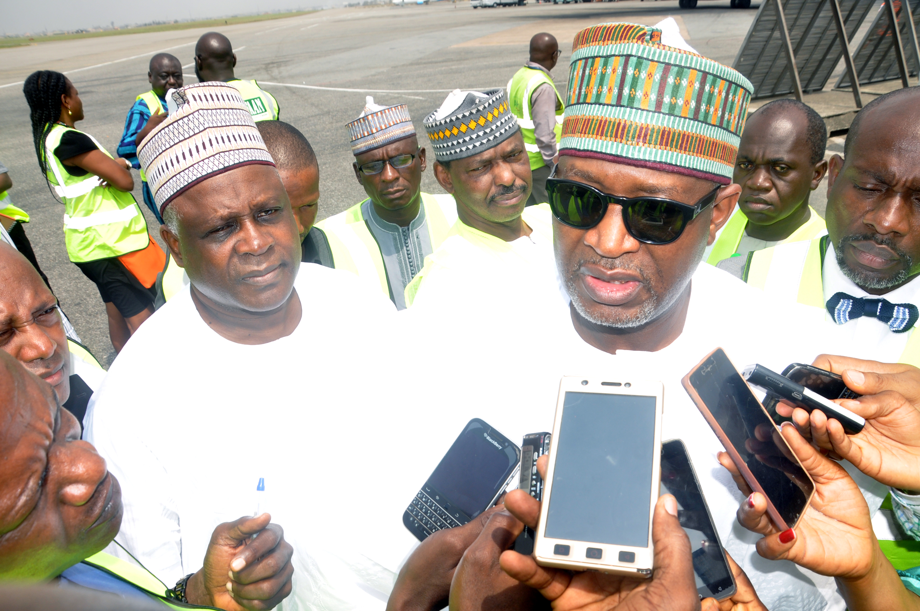 Minister of state Aviation, Capt. Hadi Sirika, (right) speaking to Aviation Journalists on some current issues with him are Director General, Nigerian Civil Aviation Authority, (NCCA), Capt. Usman Muhtar, (left) behind them is Director, Operation & Training, (DOT), Capt. Abdullahi M. Sidi at the Murtala Mohammed Airport, Ikeja, Lagos. 