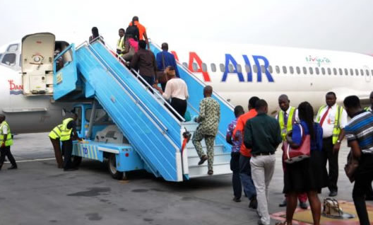 Dana Air passengers boarding its flight from Lagos to Abuja today Thursday