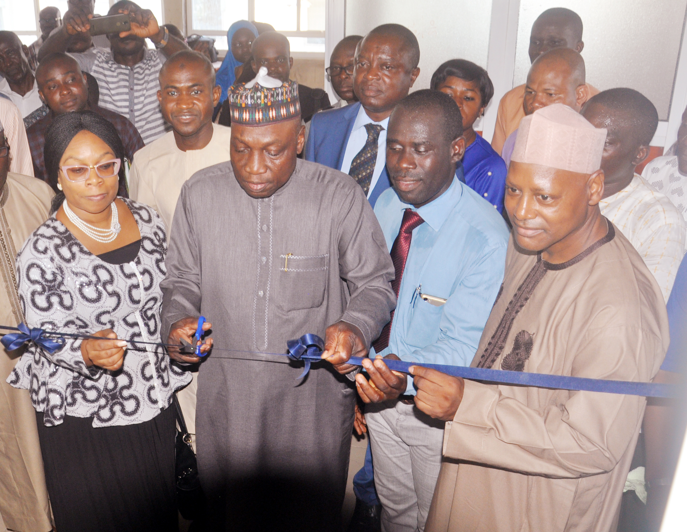 Managing Director, Federal Airport Authority of Nigeria, (FAAN), Engr. Saleh Dunoma, (Centre) cutting the tape. Others from left, Director of Finance and Account, (FAAN) Mrs. Nike Aboderin, Chairman, League of Airports and Aviation Correspondents, (LAAC) Mr. Olusegun  Koiki and Director of Commercial and Business Development, (FAAN) Mr. Sadiku Rafindadi  at the commissioning of LAAC press centre, Murtala  Muhammed Airport, Ikeja, Lagos on Tuesday.